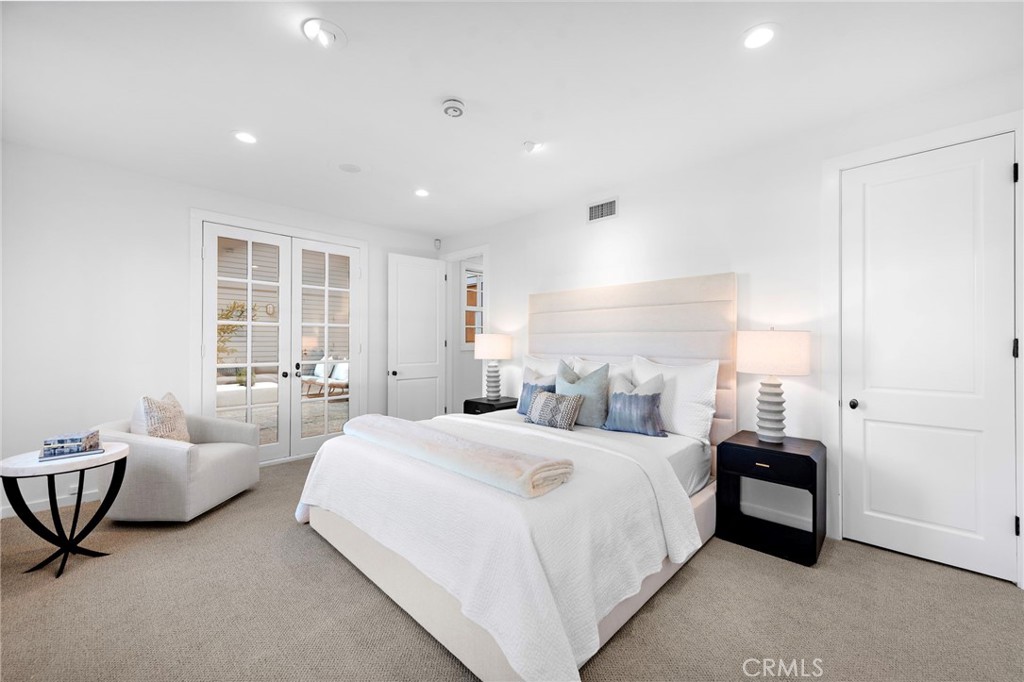 521 Kings Road Newport Beach, CA 92663 - Photo 29 of 48 a bedroom with bed and a couch