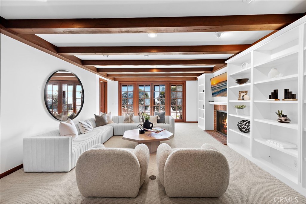521 Kings Road Newport Beach, CA 92663 - Photo 30 of 48 a living room with fireplace furniture and a large window