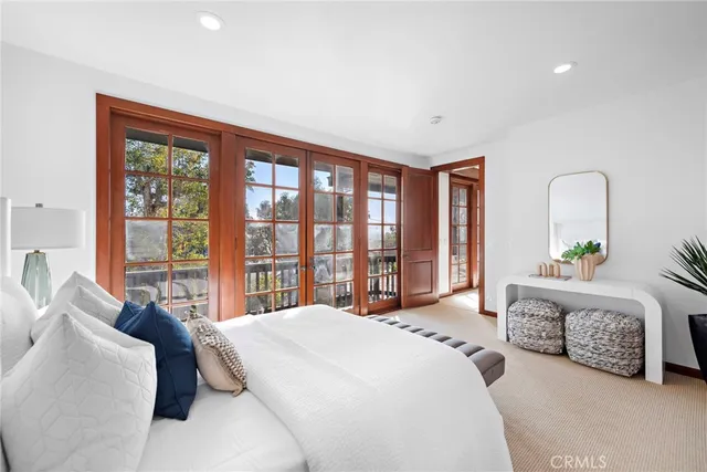 a bedroom with a bed and a couch