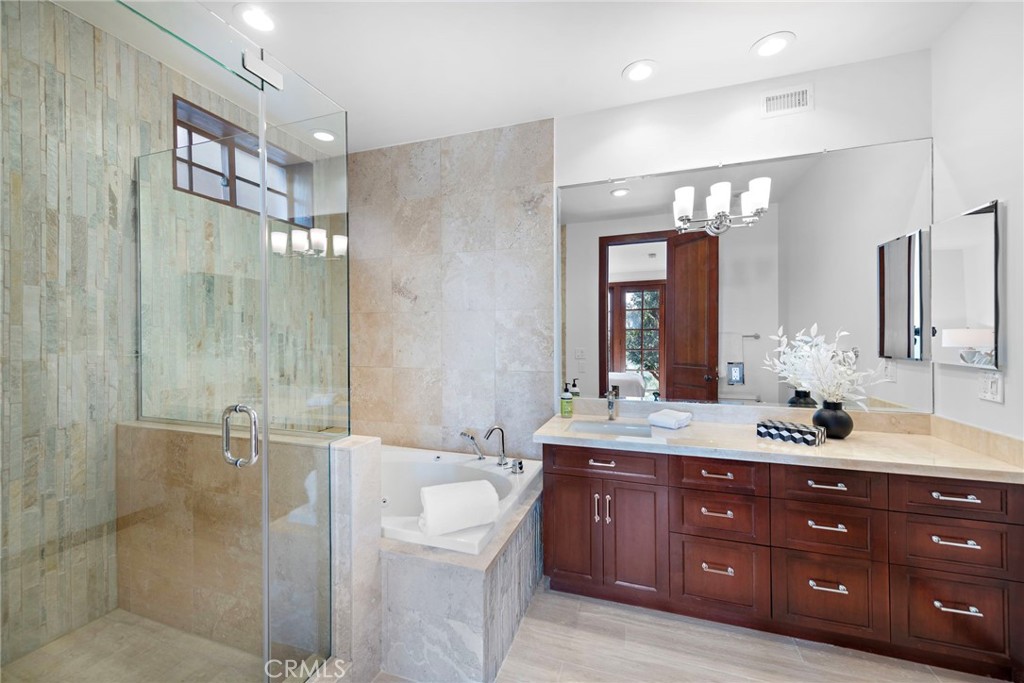 521 Kings Road Newport Beach, CA 92663 - Photo 35 of 48 a bathroom with a granite countertop sink mirror and shower