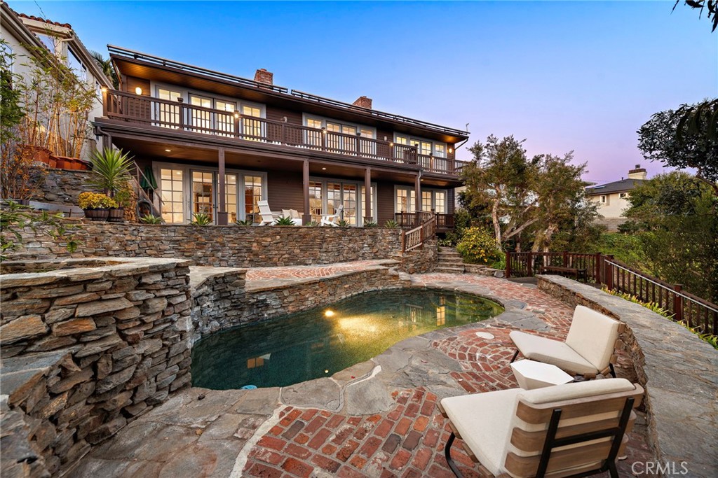 521 Kings Road Newport Beach, CA 92663 - Photo 43 of 48 a front view of a house with swimming pool