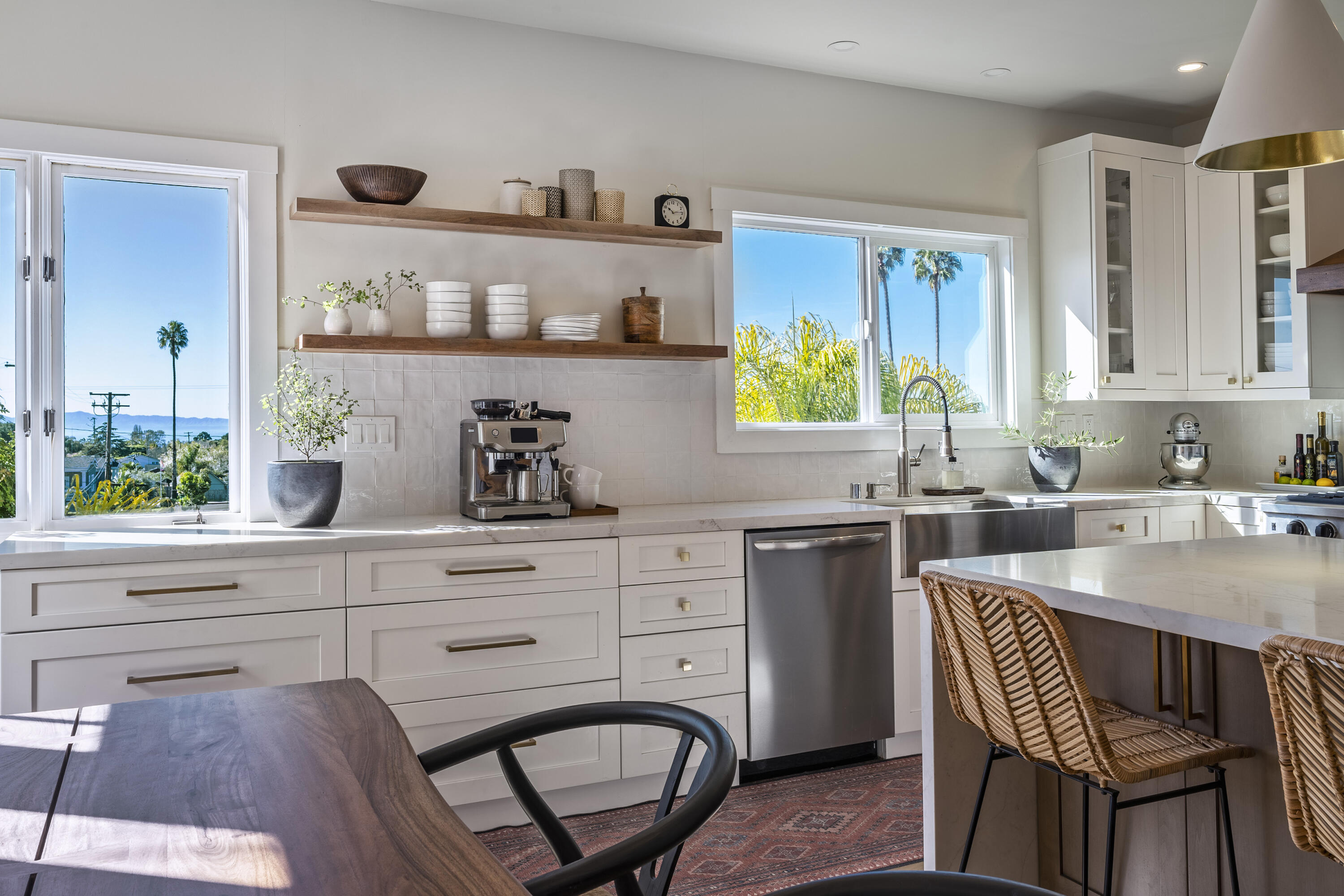 435 Fellowship Road Santa Barbara, CA 93109 - Photo 11 of 38 a kitchen with stainless steel appliances a dining table chairs and a window