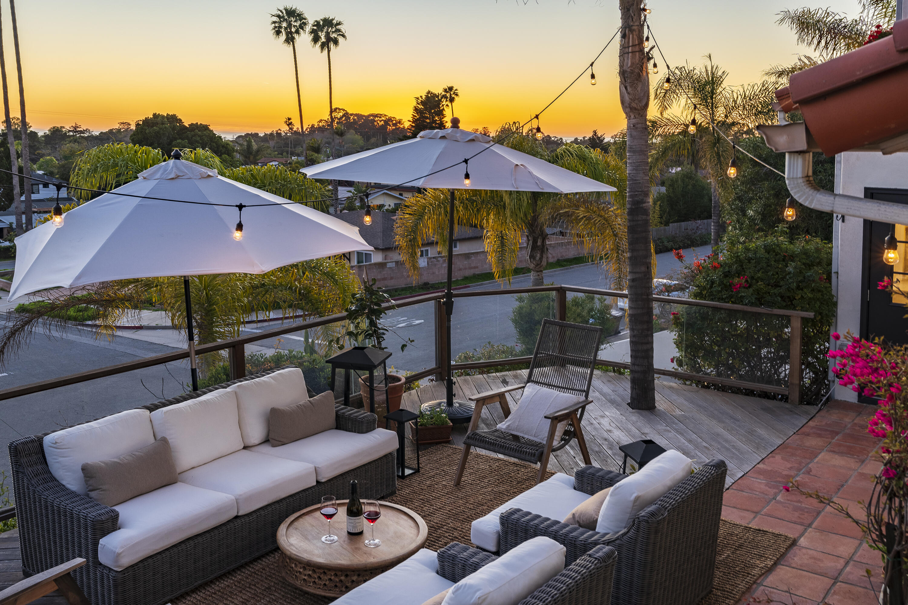 435 Fellowship Road Santa Barbara, CA 93109 - Photo 14 of 38 a view of a patio with couches under an umbrella