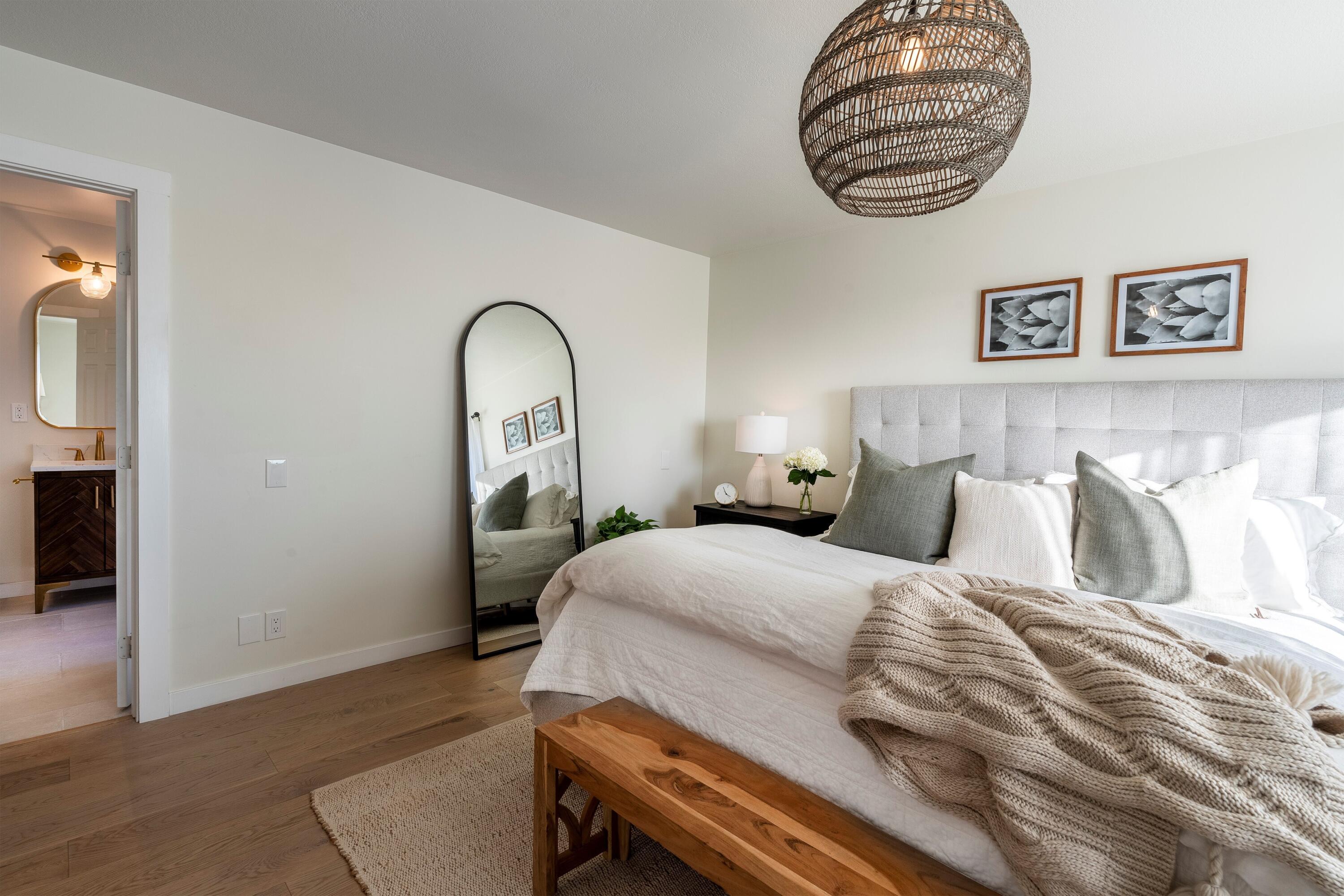 435 Fellowship Road Santa Barbara, CA 93109 - Photo 17 of 38 a bedroom with a bed and a painting on the wall