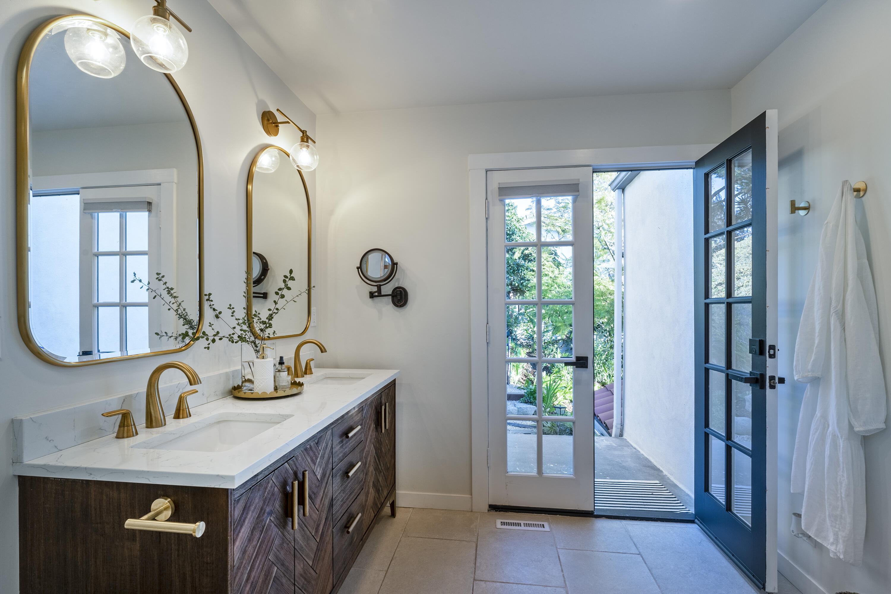 435 Fellowship Road Santa Barbara, CA 93109 - Photo 19 of 38 a bathroom with a double vanity sink and a mirror