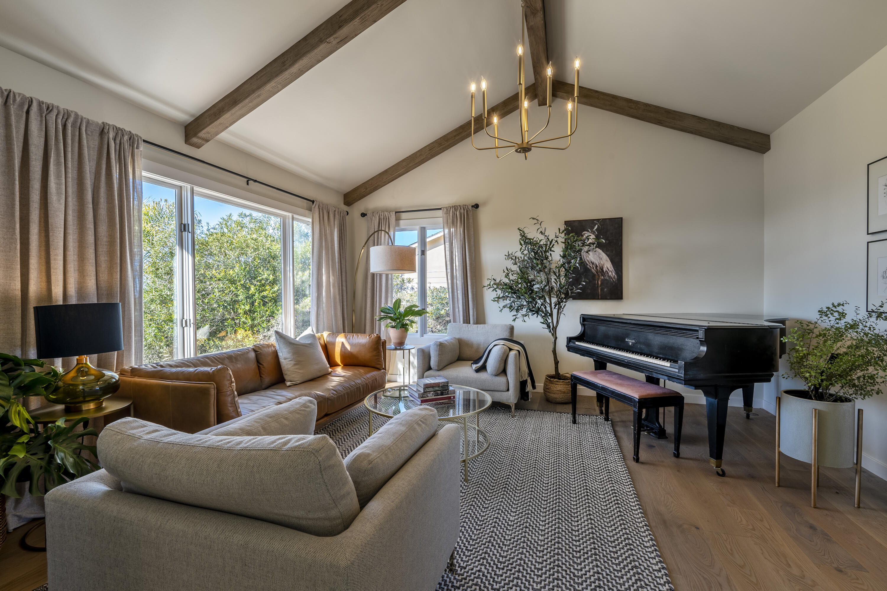 435 Fellowship Road Santa Barbara, CA 93109 - Photo 4 of 38 a living room with furniture a flat screen tv and a large window