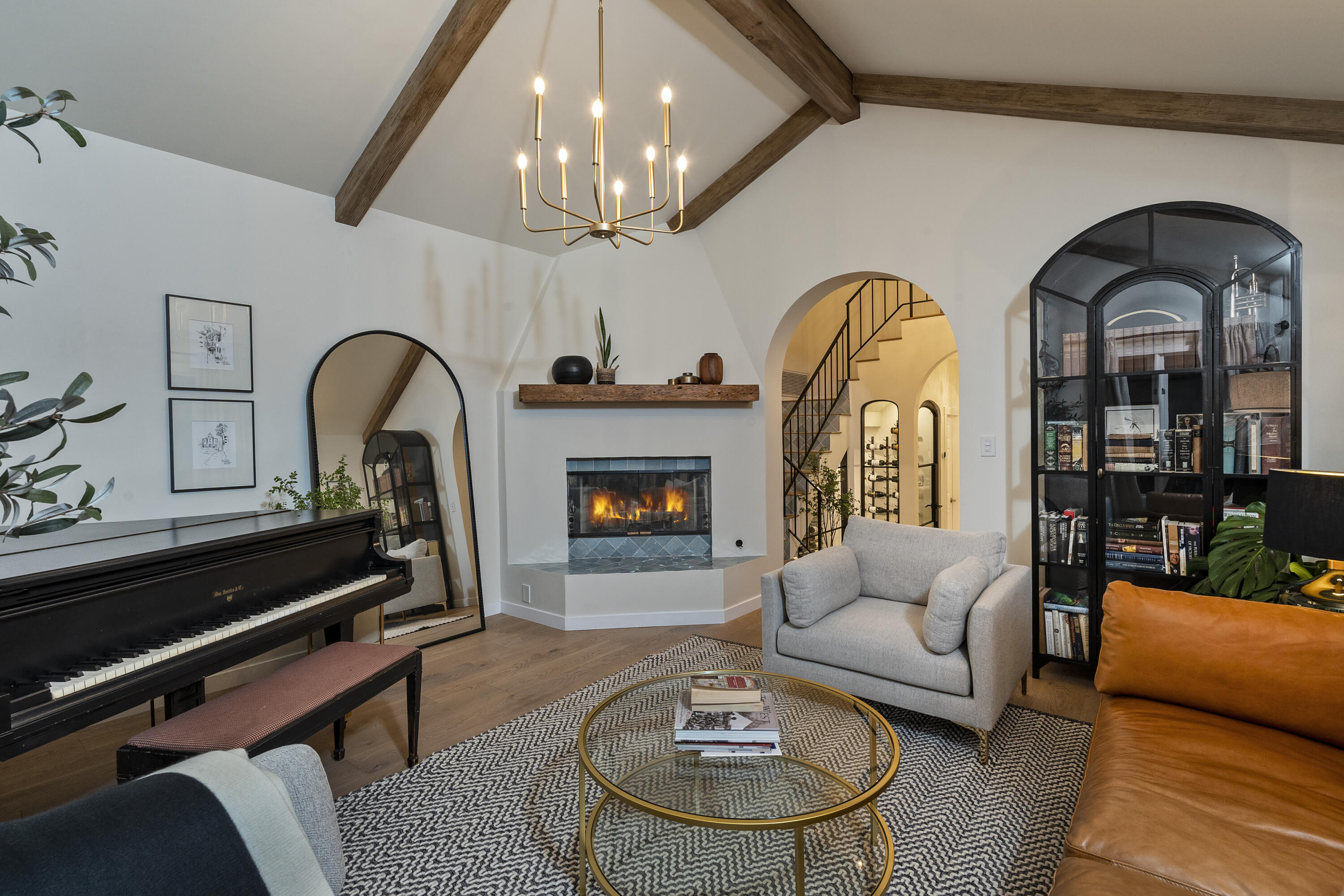 435 Fellowship Road Santa Barbara, CA 93109 - Photo 6 of 38 a living room with furniture a chandelier and a fireplace