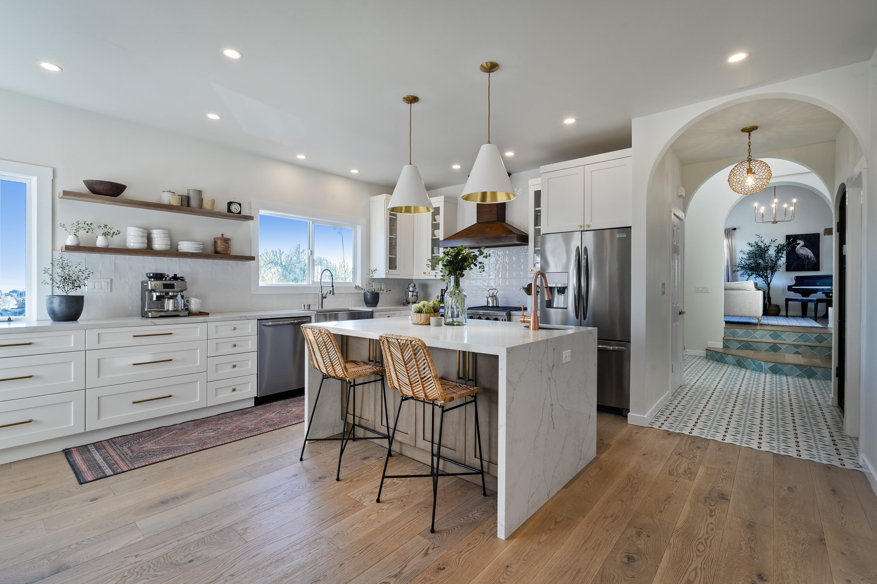 435 Fellowship Road Santa Barbara, CA 93109 - Photo 7 of 38 a kitchen with stainless steel appliances kitchen island granite countertop a table chairs and a refrigerator