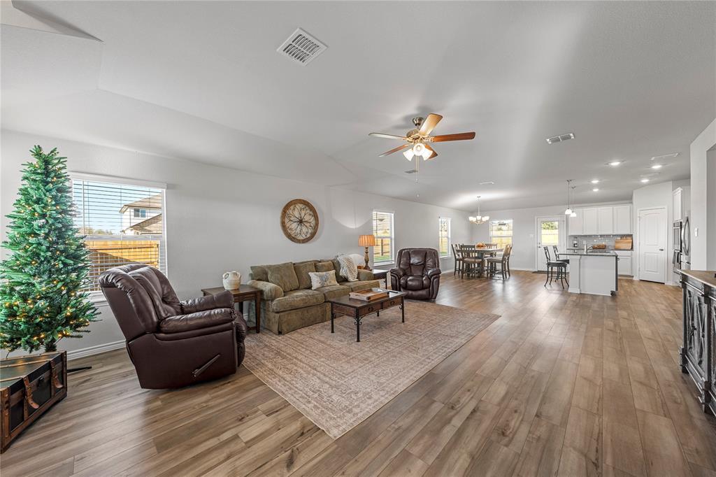 10761 Chesson Flts Drive Waco, TX 76708 - Photo 7 of 30 a living room with furniture and a wooden floor