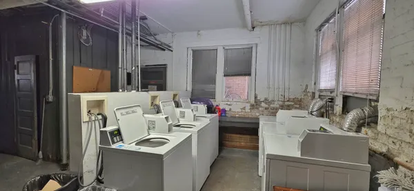 a view of a kitchen with a sink and dishwasher