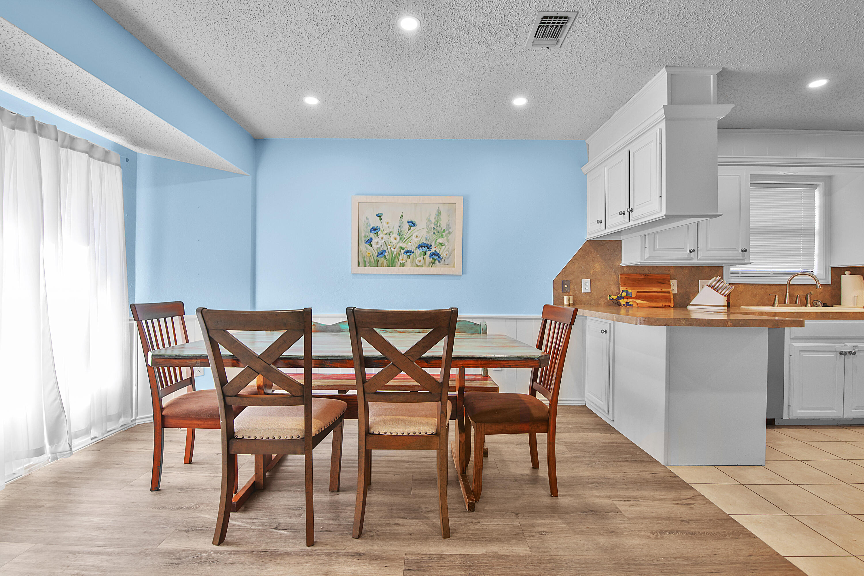4805 73rd Street Lubbock, TX 79424 - Photo 11 of 26 a table and chairs in a kitchen