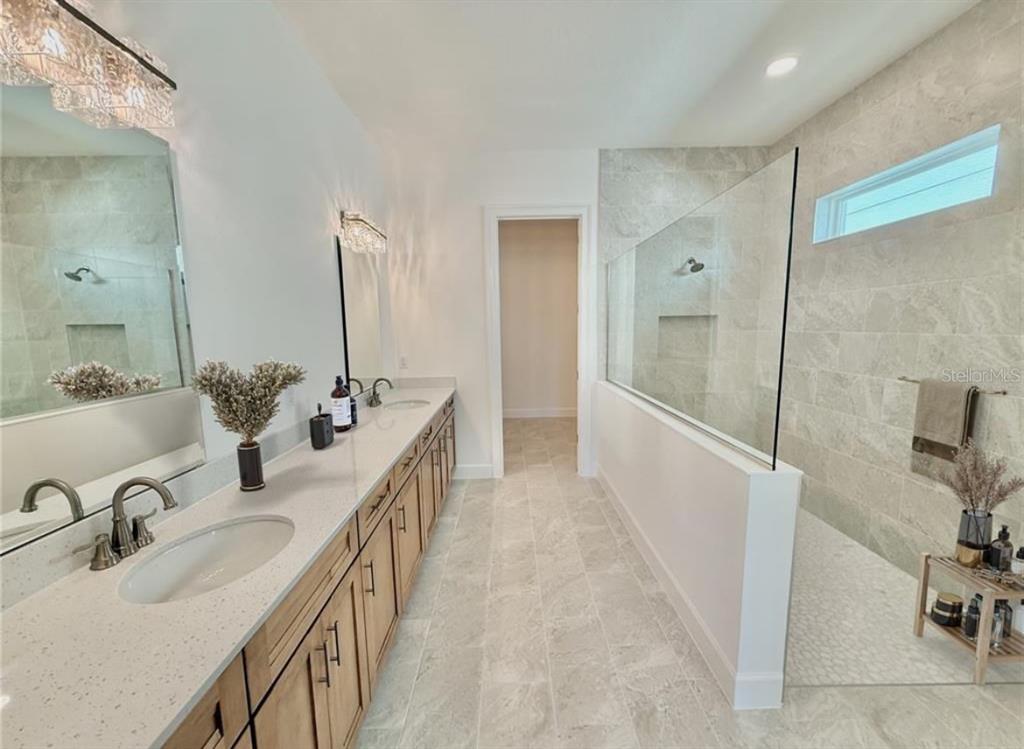 4 Coronado Road Flagler Beach, FL 32136 - Photo 20 of 30 a bathroom with double vanity sink and a mirror