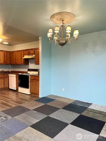 a kitchen with a stove and a sink