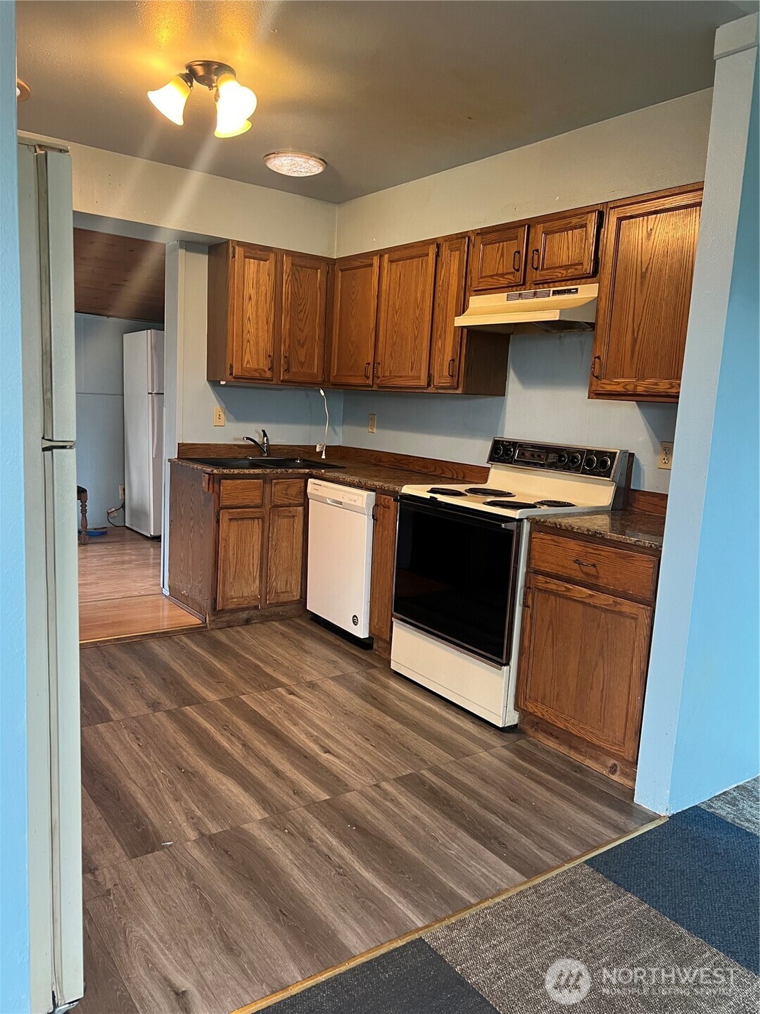 111 Lower Tower Street Riverside, WA 98849 - Photo 13 of 40 a kitchen with stainless steel appliances granite countertop a stove a sink and a microwave