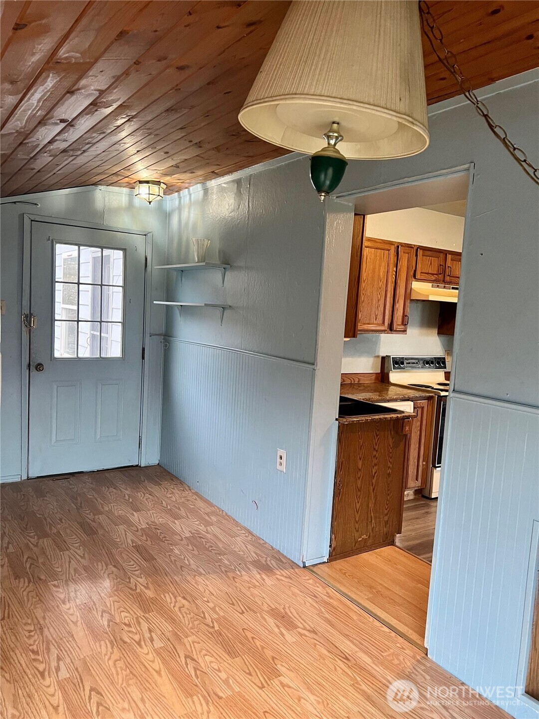 111 Lower Tower Street Riverside, WA 98849 - Photo 16 of 40 a bedroom with a bed and a chandelier