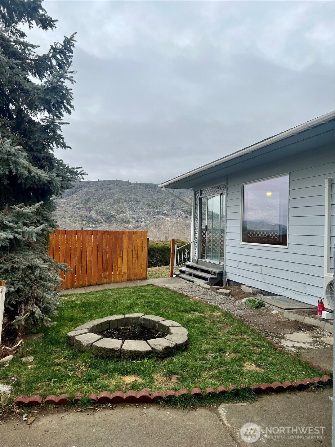 111 Lower Tower Street Riverside, WA 98849 - Photo 27 of 40 a view of a backyard with table and chairs and potted plants