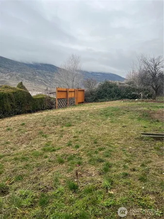 a view of a field with an ocean