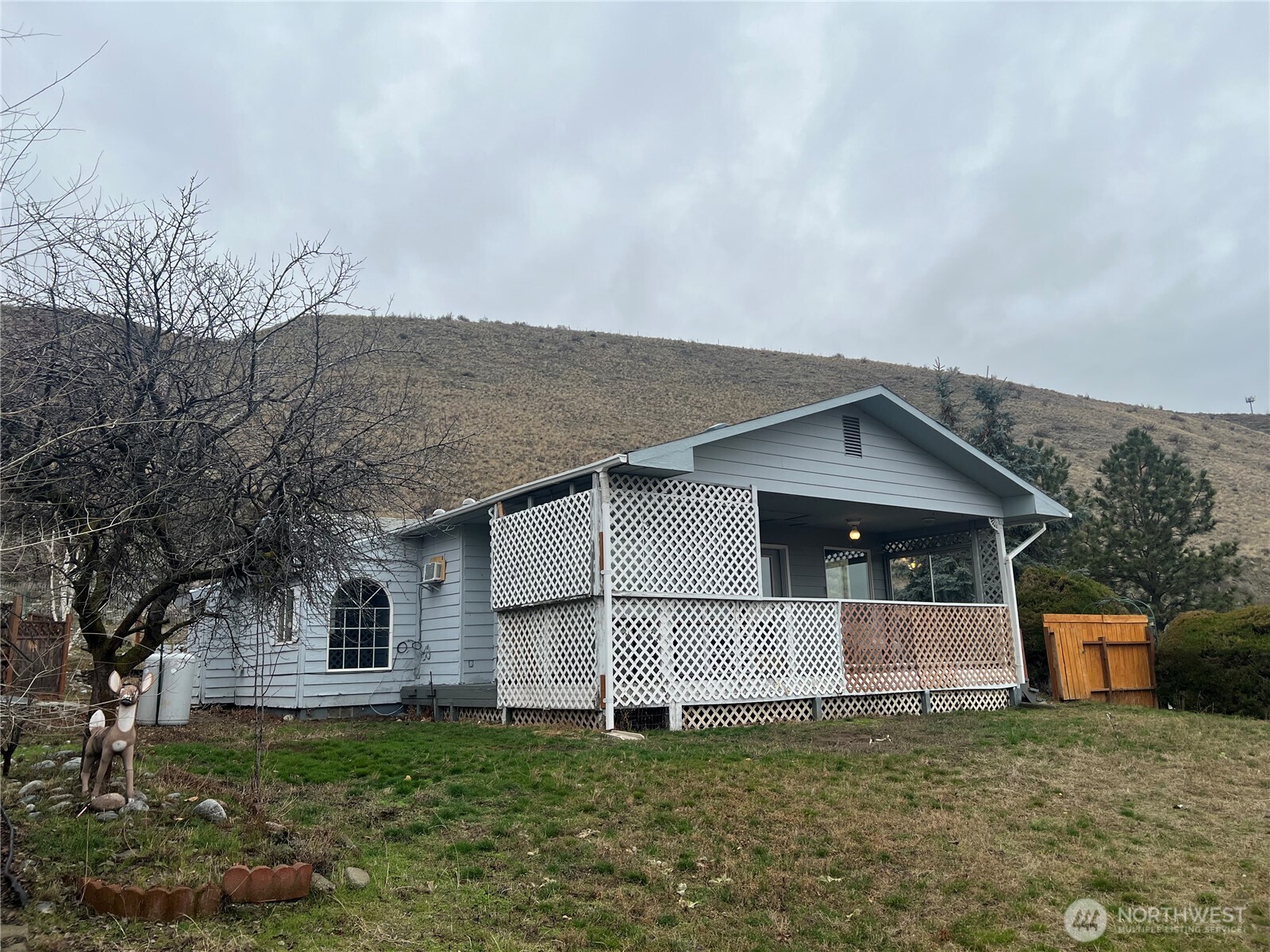 111 Lower Tower Street Riverside, WA 98849 - Photo 33 of 40 a front view of a house with a yard and garage