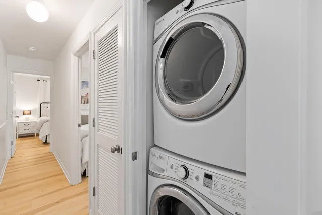 a view of a hallway with washer and dryer
