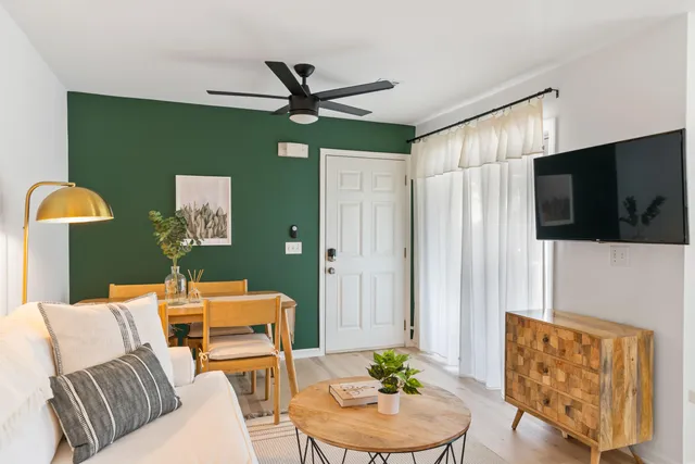 a living room with furniture and a flat screen tv