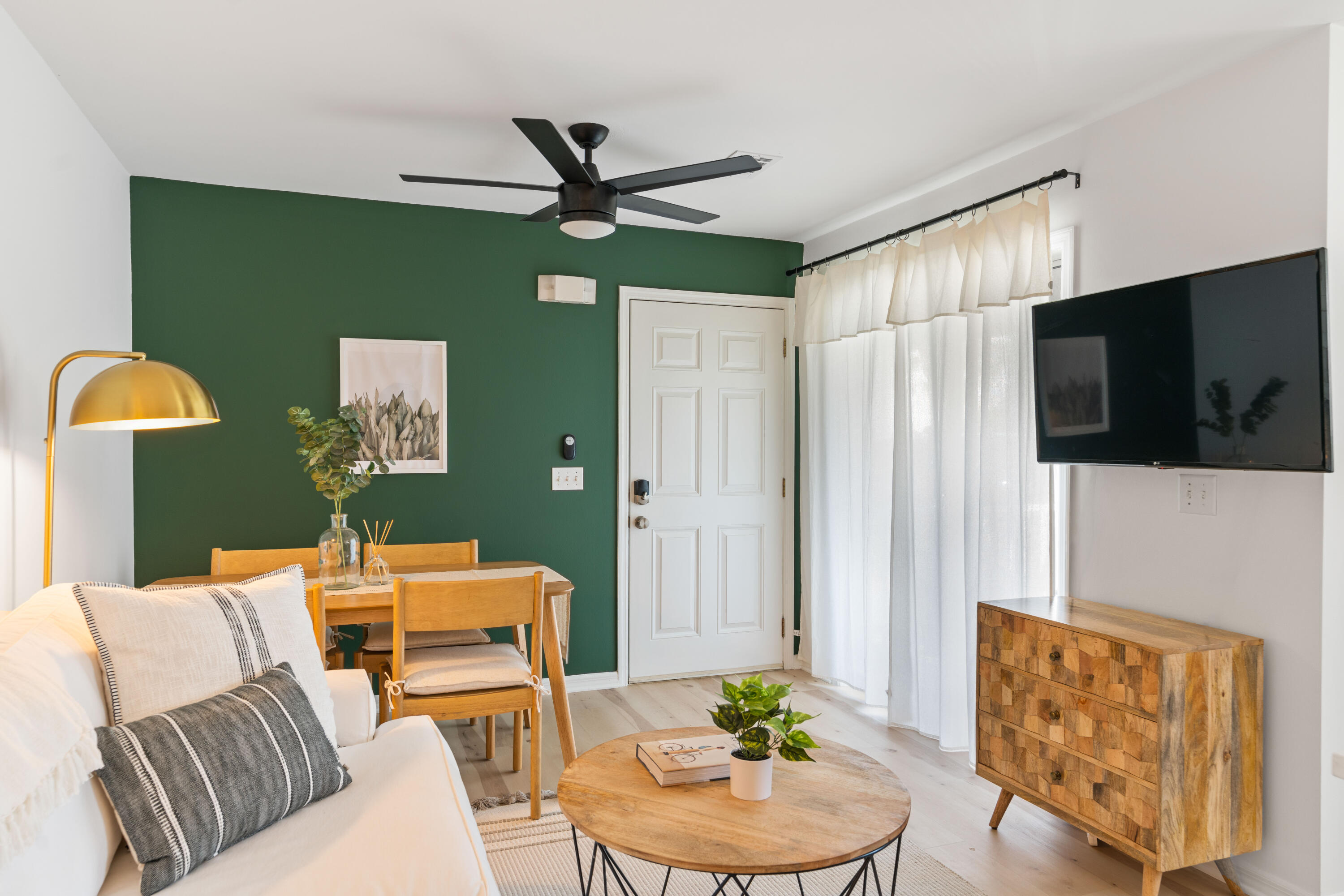 11 Beachside Drive, Unit 913 Santa Rosa Beach, FL 32459 - Photo 2 of 43 a living room with furniture and a flat screen tv
