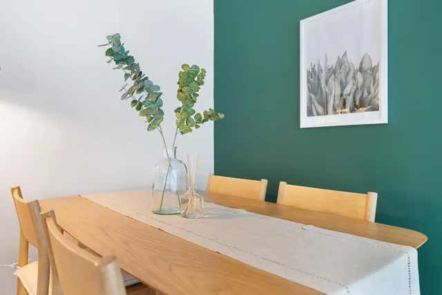 a vase of flowers sitting on a table