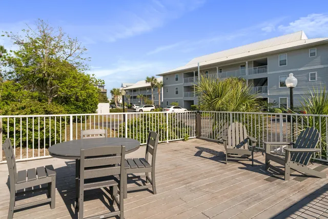 a view of a chair and table on the deck
