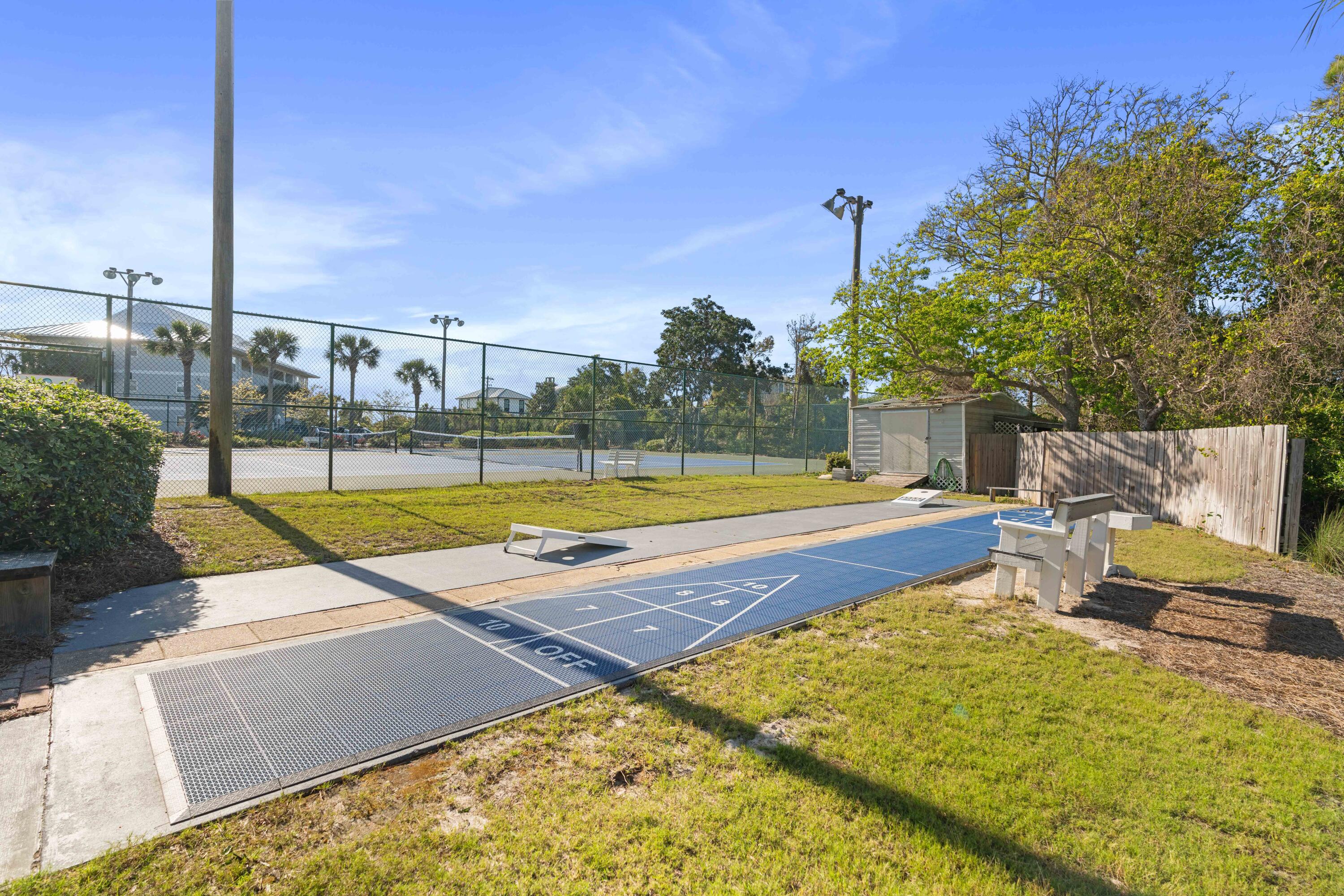 11 Beachside Drive, Unit 913 Santa Rosa Beach, FL 32459 - Photo 39 of 43 a view of swimming pool with seating area and trees in the background