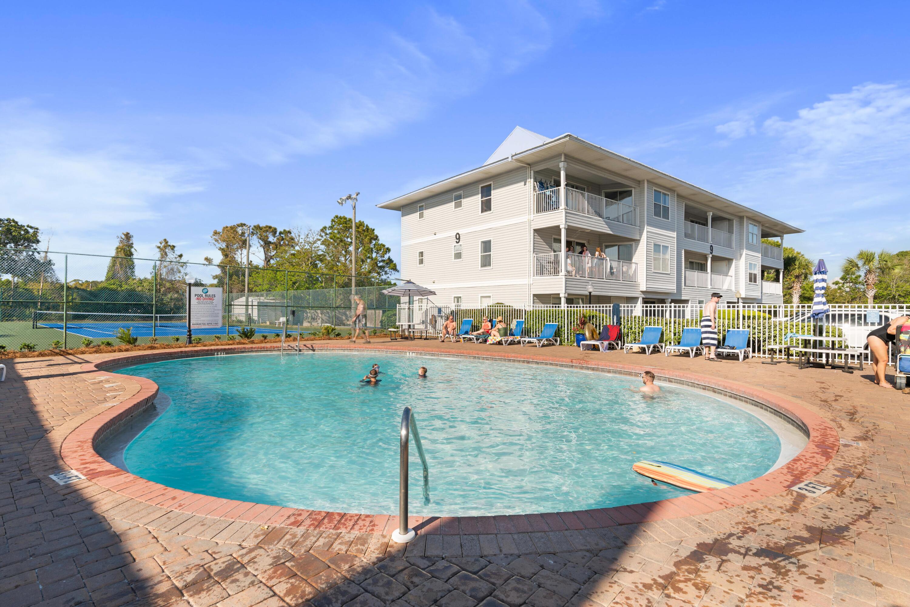 11 Beachside Drive, Unit 913 Santa Rosa Beach, FL 32459 - Photo 42 of 43 a view of a swimming pool with outdoor seating