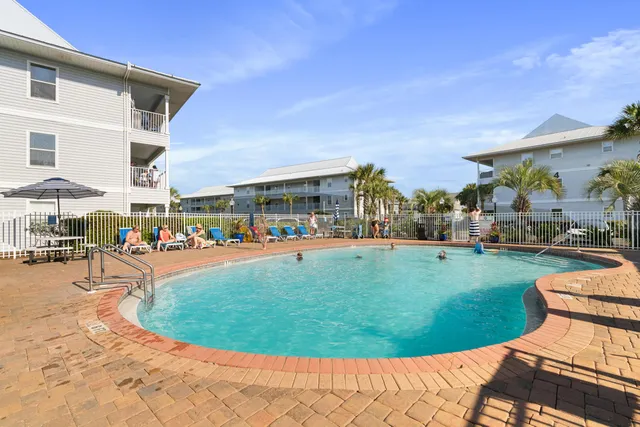 a view of a swimming pool with a patio