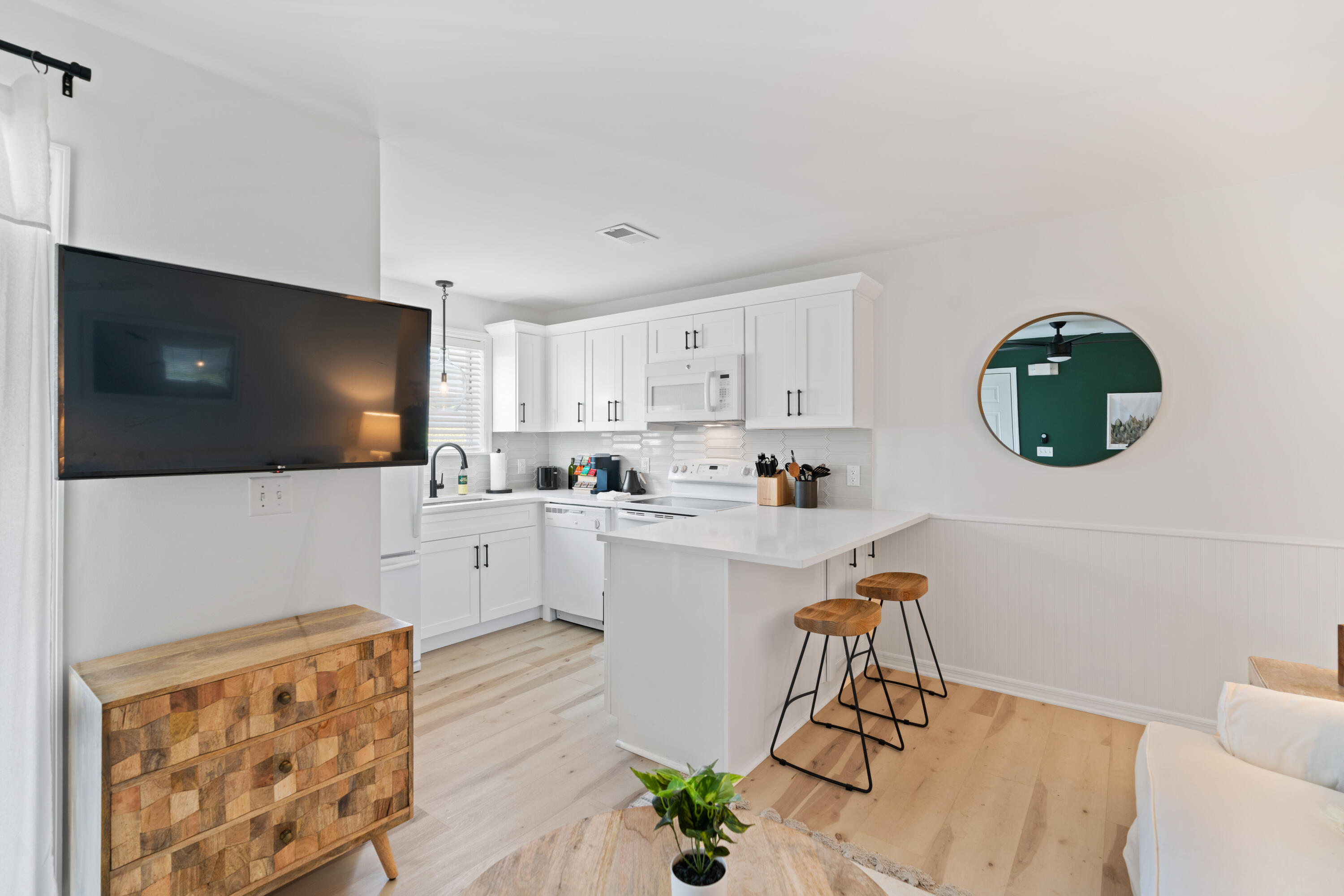 11 Beachside Drive, Unit 913 Santa Rosa Beach, FL 32459 - Photo 6 of 43 a living room with furniture and a flat screen tv