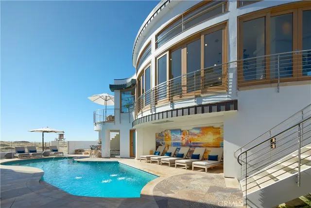 a view of a hallway with painting on the wall