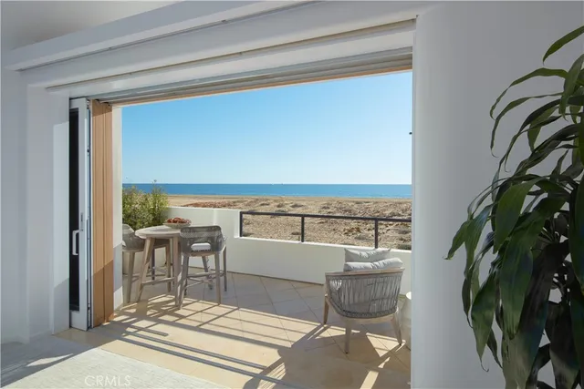 a terrace with a table and chairs