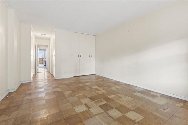 a view of a patio with table and chairs