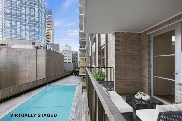 a view of a pool with a yard