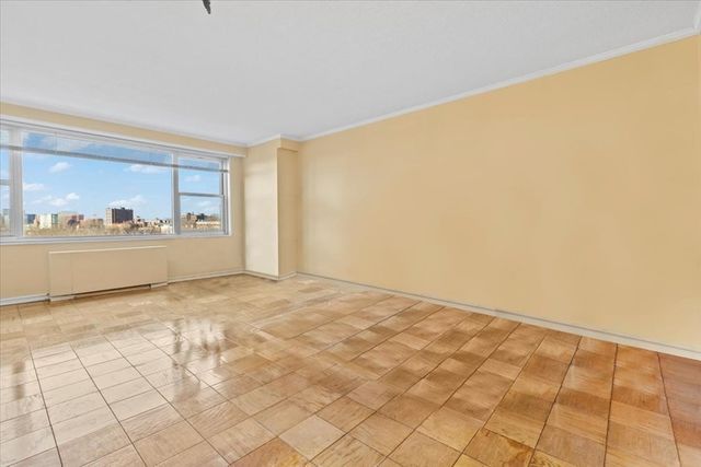 a kitchen with granite countertop a sink a stove and cabinets