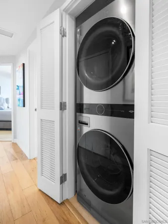 a close view of a utility room with dryer and washer