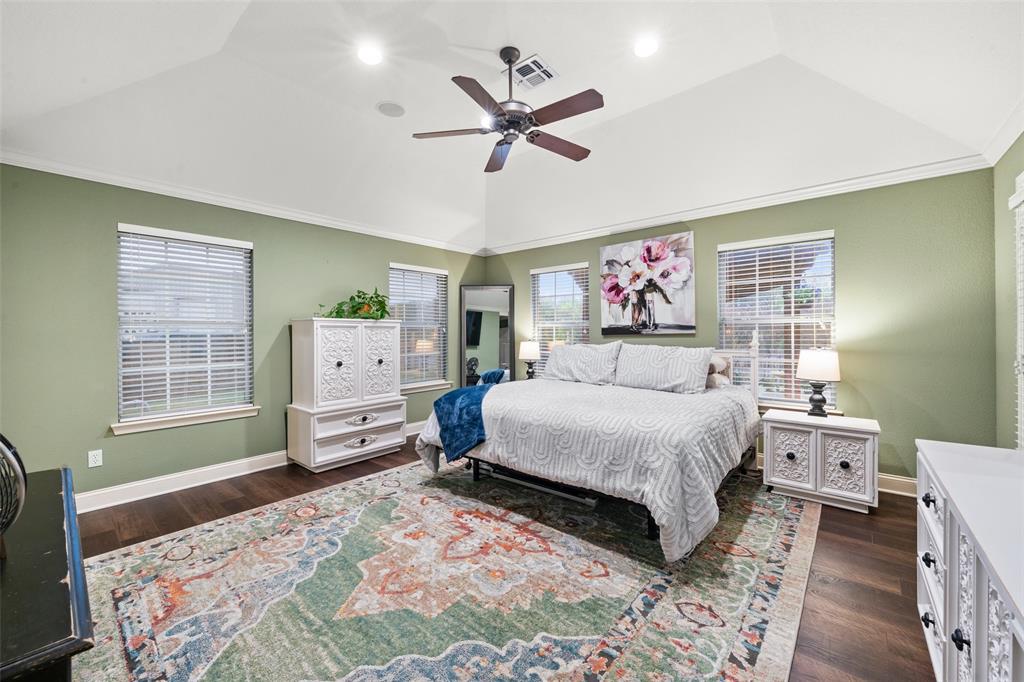 517 Chado Lane Robinson, TX 76706 - Photo 17 of 40 Primary Bedroom featuring a ceiling fan, dark wood finished floors, lofted ceiling, and recessed lighting