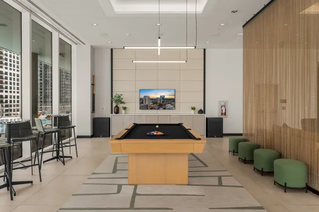 a living room with furniture a rug and a fireplace