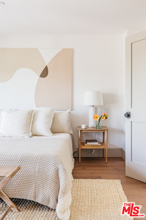 1321 North Benton Way Los Angeles, CA 90026 - Photo 12 of 27 a bedroom with a bed and a table