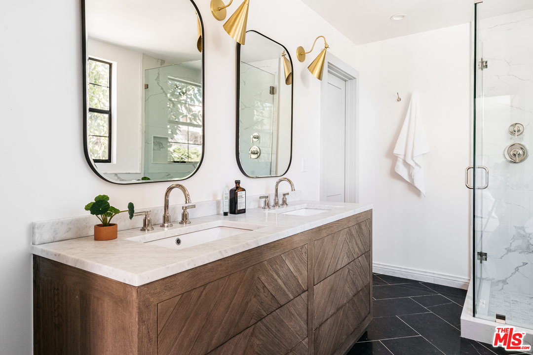 1321 North Benton Way Los Angeles, CA 90026 - Photo 13 of 27 a bathroom with a sink vanity and a mirror