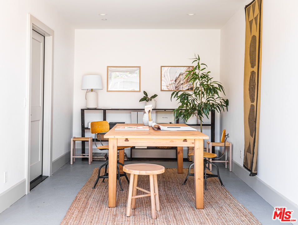 1321 North Benton Way Los Angeles, CA 90026 - Photo 20 of 27 a dining room with furniture and wooden floor