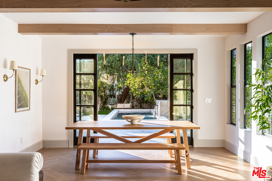 1321 North Benton Way Los Angeles, CA 90026 - Photo 5 of 27 a living room with a table and a potted plant