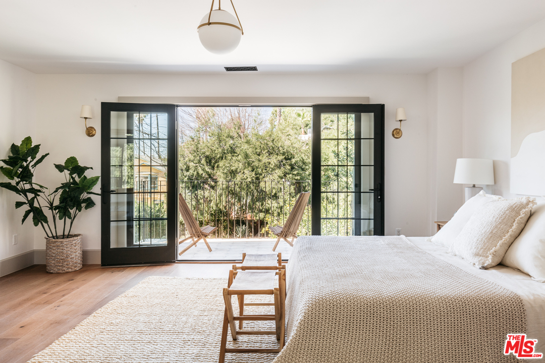 1321 North Benton Way Los Angeles, CA 90026 - Photo 10 of 27 a bedroom with a large bed and a large window