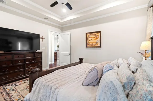 a spacious bathroom with a tub sink and mirror