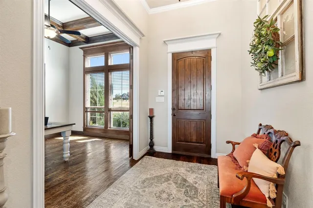 a bedroom with double bed and a dresser