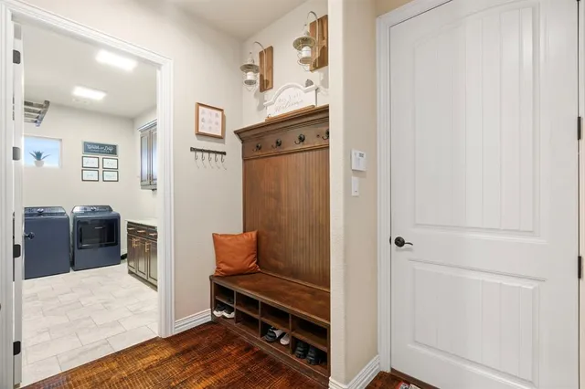 a kitchen with granite countertop a sink stove and refrigerator