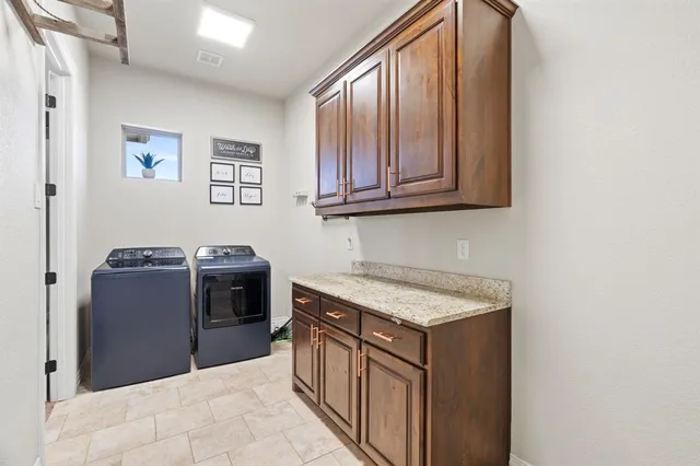 a view of a living room and a patio with a table and chairs