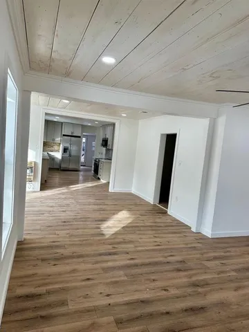 a view of a livingroom with wooden floor