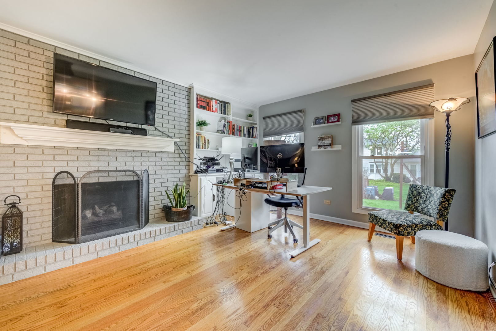 1220 Arthur Road Naperville, IL 60540 - Photo 11 of 24 a living room with furniture a flat screen tv and a fireplace